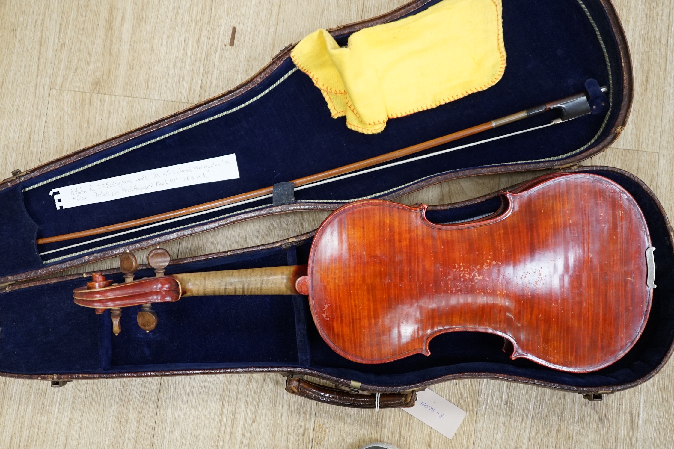 An English cased violin by Thomas J. Bellingham, Leeds, 1909, body length, 35.5cm, with a chased silver mounted bow CITES Submission reference WNR7TU27